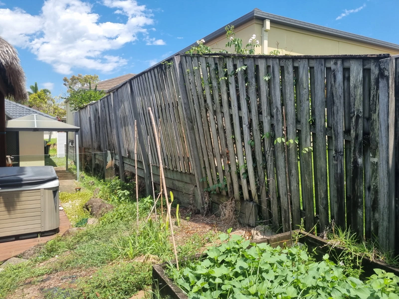 Sloped yard before retaining wall